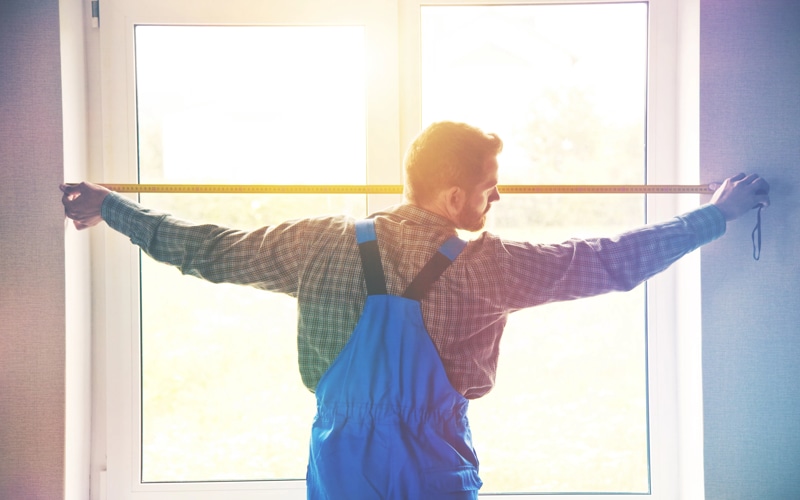 Measure your window to hang blackout curtains