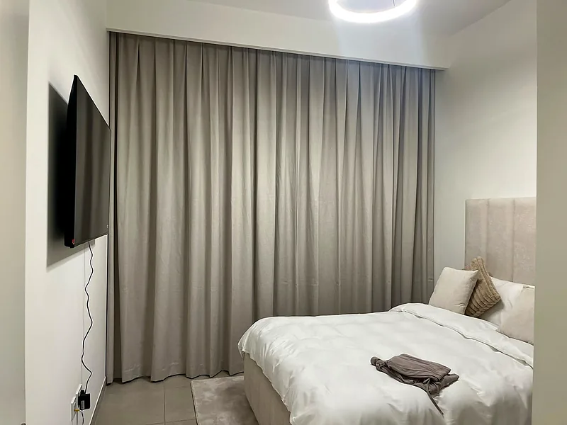 Linen-look curtains on a ceiling track