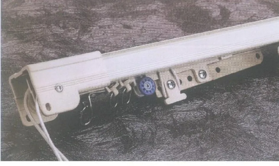 Cord-operated ceiling curtain track with pulley