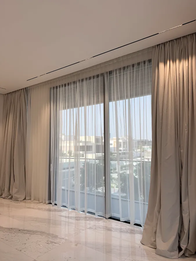 Ceiling track over sliding doors