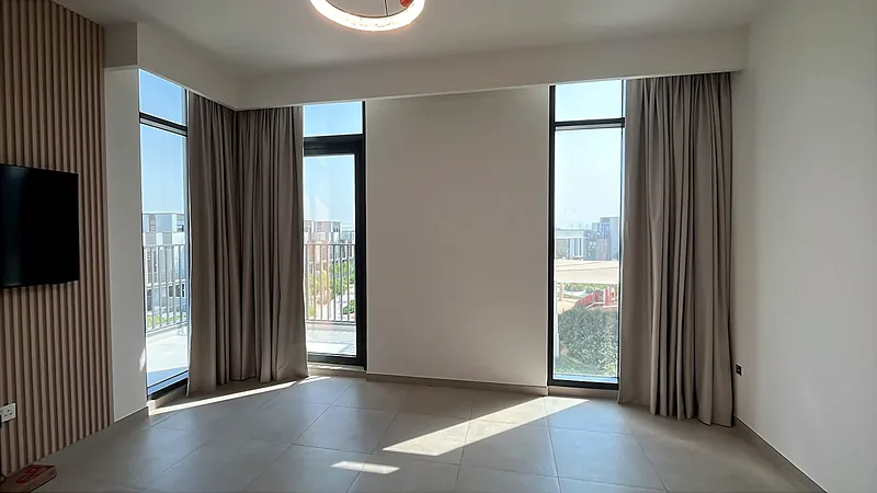 Curtains on tall windows in a living room