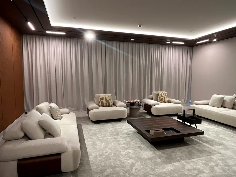 Motorized curtains under LED cove lighting