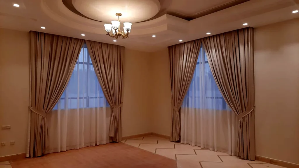 Villa curtains with sheers and tie-backs on two windows