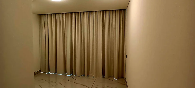 White wave curtains on a ceiling track